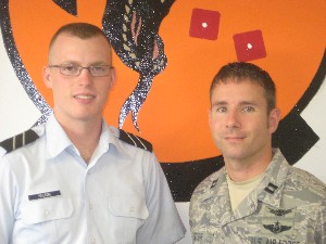 In August, Capt. Timothy Secor, USAF (r), education officer, congratulates Cadet Capt. Aaron Nelson, Air Force ROTC, on his AFCEA scholarship award.